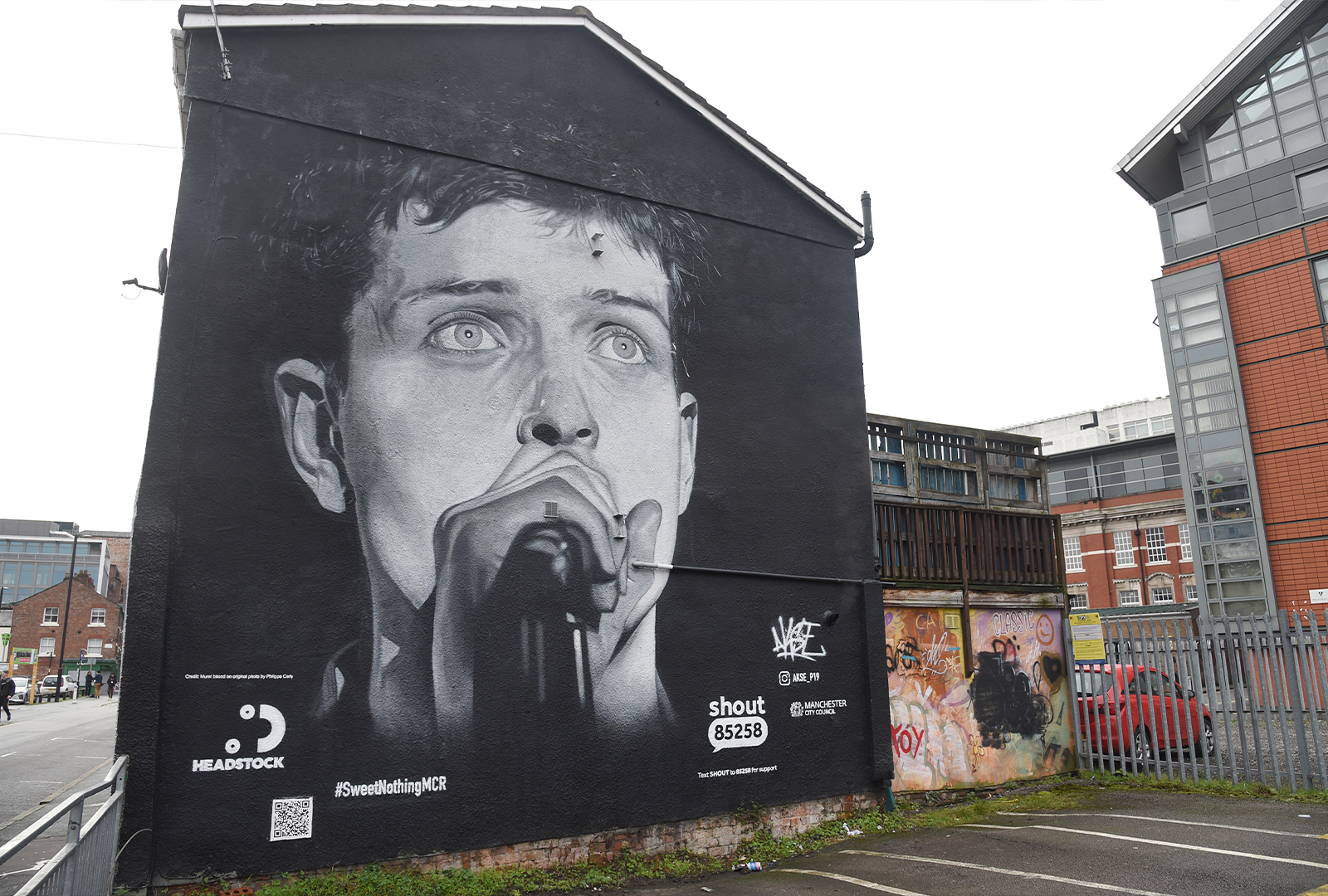 An Ian Curtis mural in Manchester has been painted over with an advert