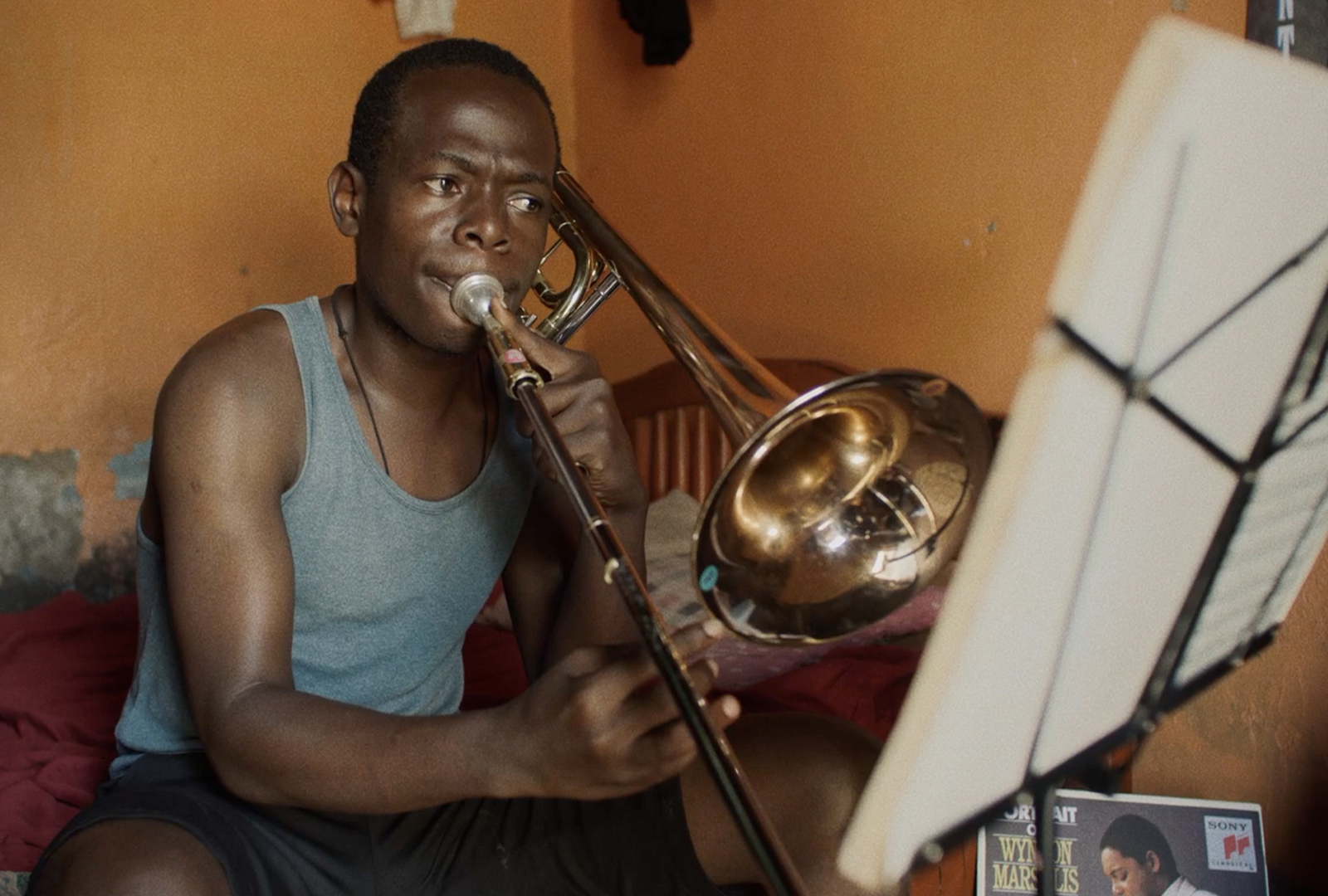 Kid playing the trombone during a jazz concert